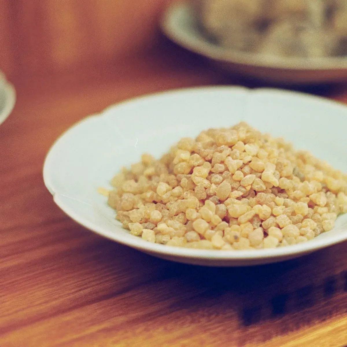 Hand-sorted frankincense resin pieces in a bowl