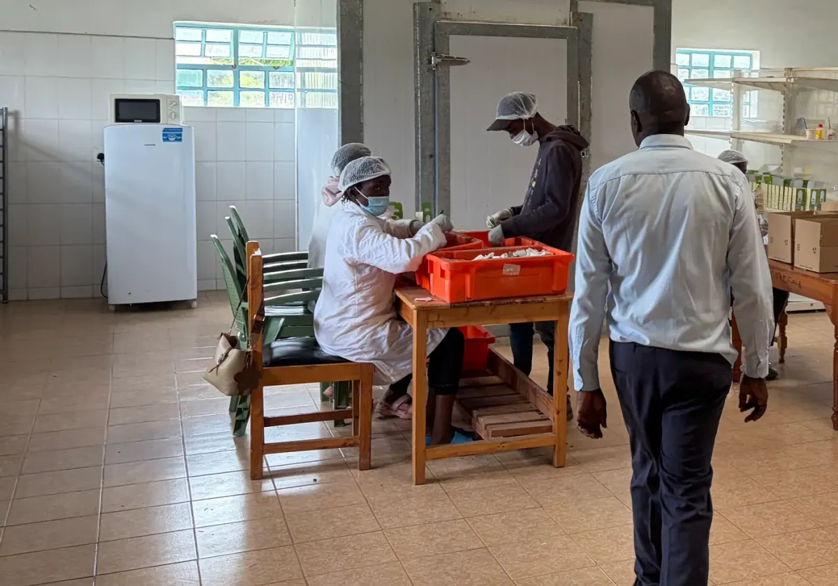 A quality team preparing material at a processing facility